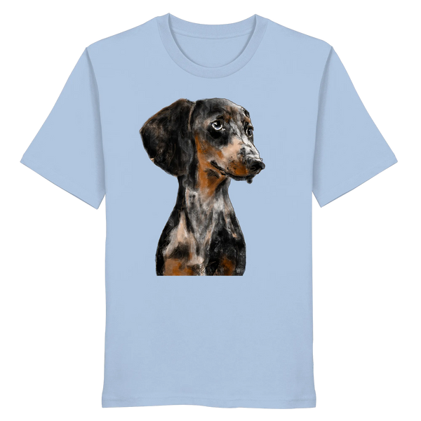 Handgezeichnetes Dackel-Motiv "Klugi" auf einem hellblauen Bio-T-Shirt.